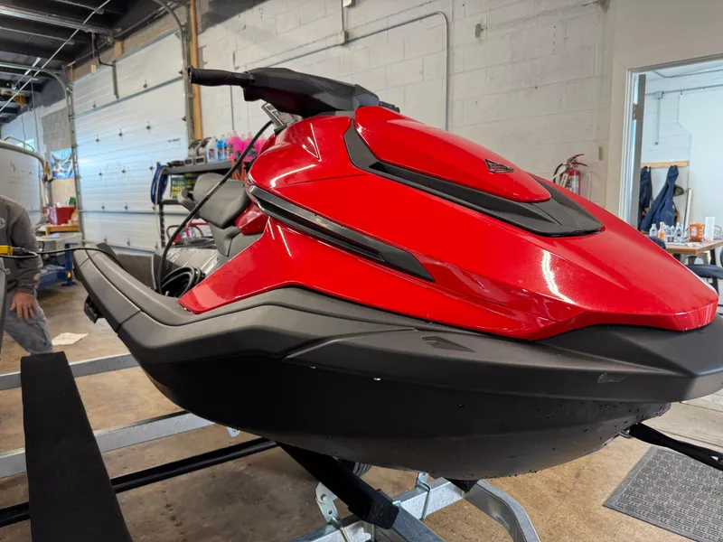 Slide: The Image of 2024 Taiga Orca electric jet skis at Elk Rapids Marina, displayed outdoors. - 5