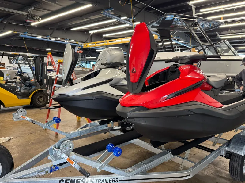 Slide: The Image of 2024 Taiga Orca jet ski with red and black design on a trailer. - 7