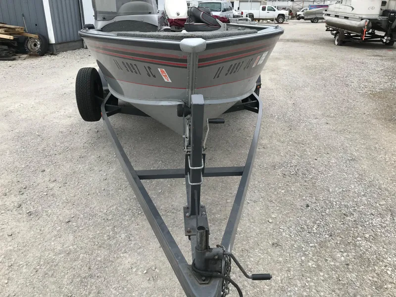 Slide: The Image of 1998 Lund 1775 Pro-V SE boat on trailer, parked on gravel lot. - 13