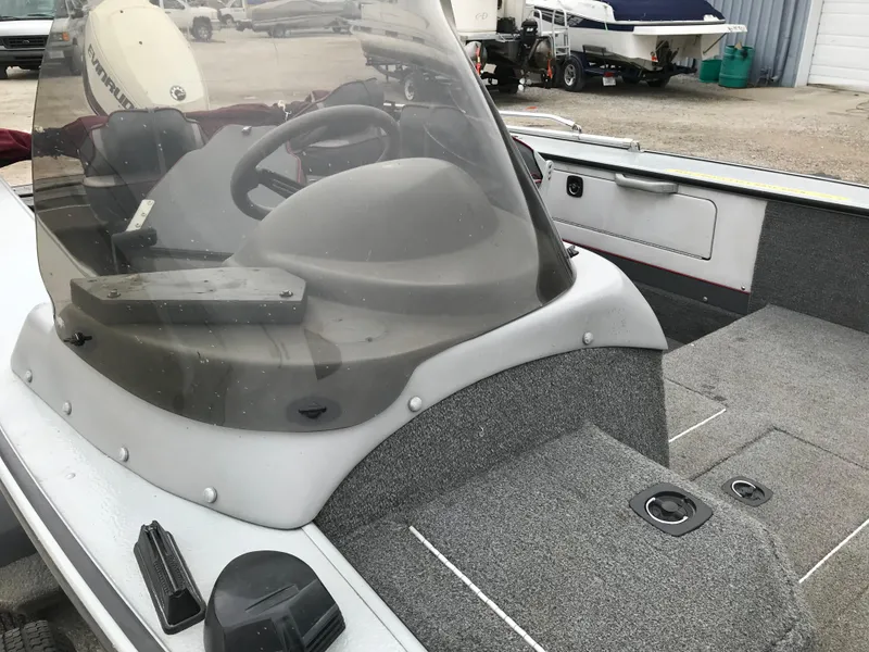 Slide: The Image of 1998 Lund 1775 Pro-V SE boat interior with steering wheel and windshield. - 18