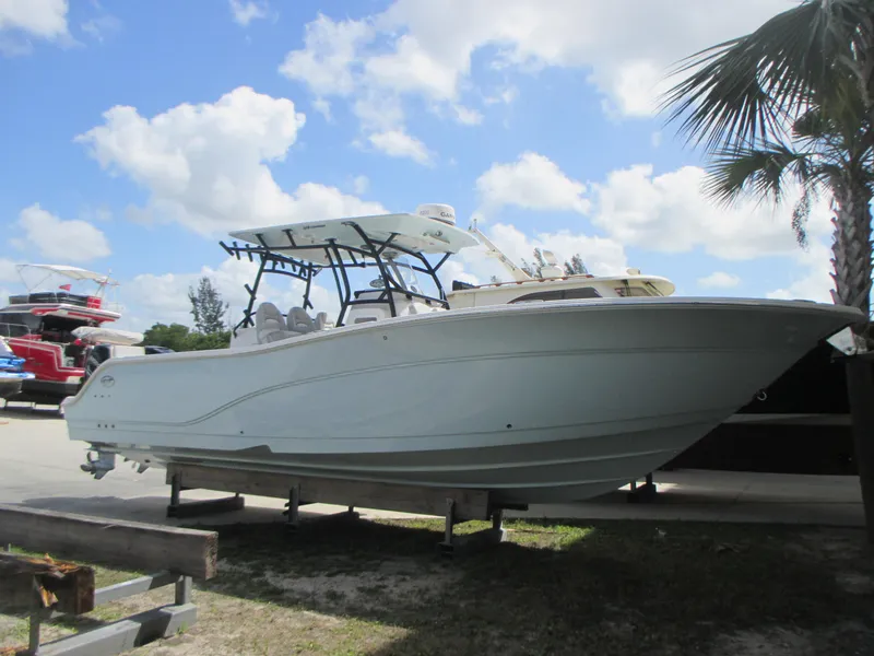 The Image of 2023 Sea Fox 328 Commander boat on display under a sunny sky. - 0