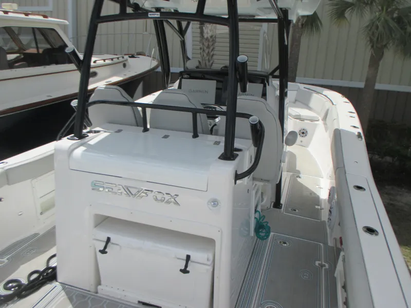 Slide: The Image of 2023 Sea Fox 328 Commander boat interior with seating and storage features. - 10