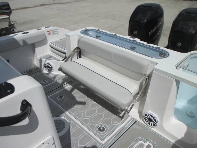 Slide: The Image of 2023 Sea Fox 328 Commander boat interior with foldable seating and modern design. - 12