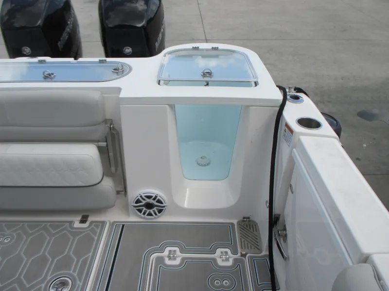 Slide: The Image of 2023 Sea Fox 328 Commander boat interior with seating, storage, and livewell. - 13