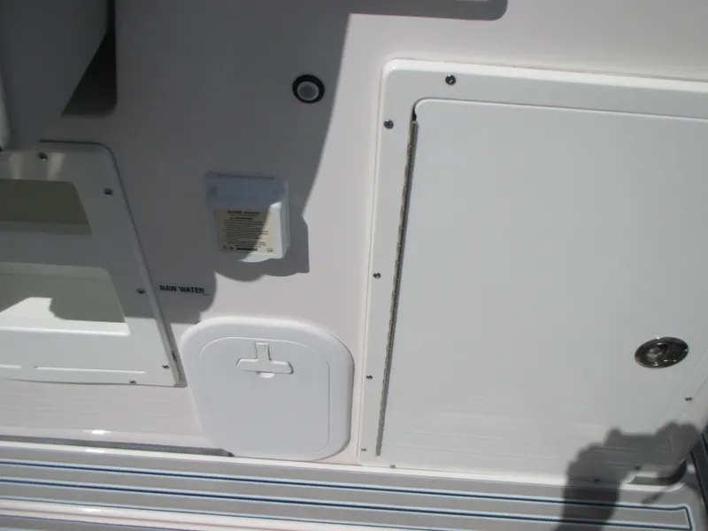 Slide: The Image of 2023 Sea Fox 328 Commander boat deck with storage compartments and access panels. - 15