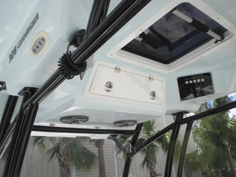 Slide: The Image of 2023 Sea Fox 328 Commander boat interior with storage compartments and control panel. - 18