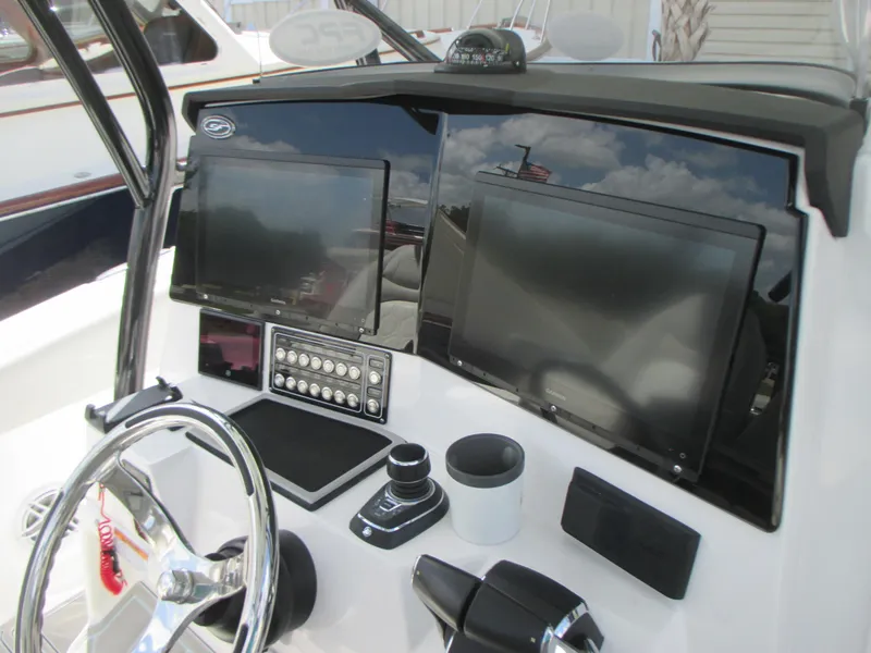 Slide: The Image of 2023 Sea Fox 328 Commander dashboard with dual screens and modern controls. - 20