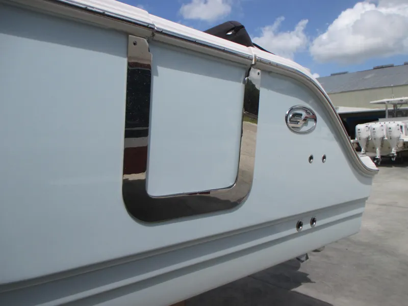 Slide: The Image of 2023 Sea Fox 328 Commander boat side view with chrome details and logo. - 4