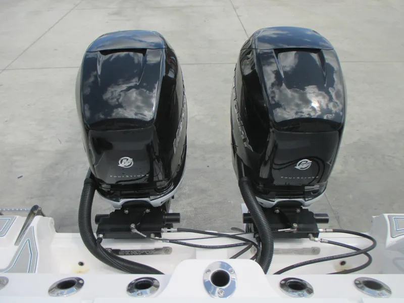 Slide: The Image of Twin Mercury outboard engines on a 2023 Sea Fox 328 Commander boat. - 5