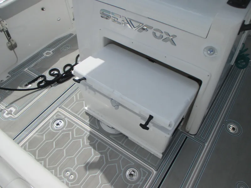 Slide: The Image of 2023 Sea Fox 328 Commander boat deck with storage compartment and non-slip flooring. - 9