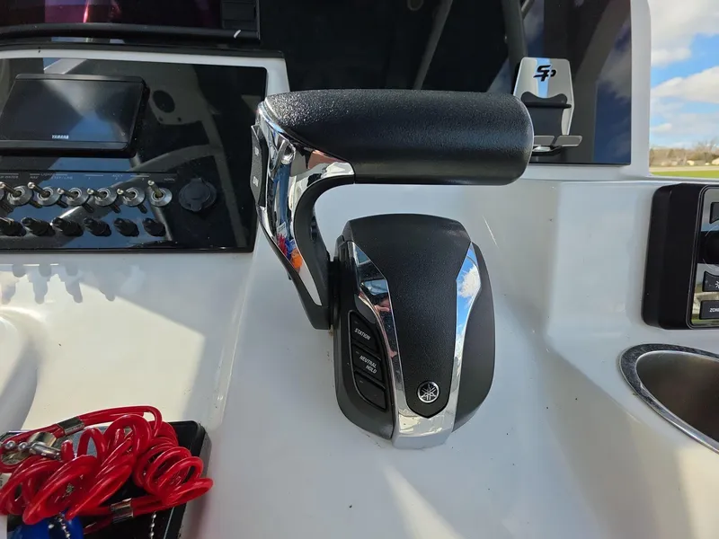 Slide: The Image of Throttle control on 2022 Sea Pro 239 Center Console boat dashboard. - 7