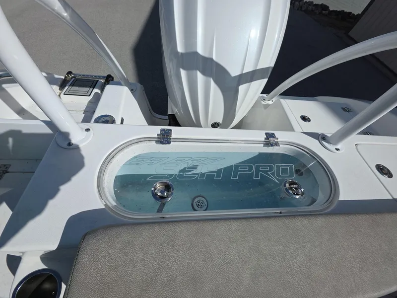 Slide: The Image of 2022 Sea Pro 239 Center Console boat with branded livewell and seating area. - 9