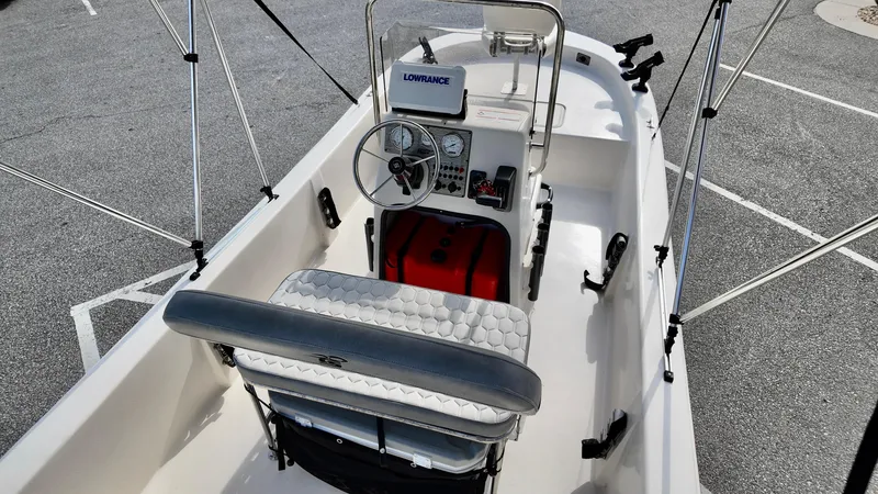 Slide: The Image of 2024 Carolina Skiff e18 JVX boat interior with steering console and seating. - 15