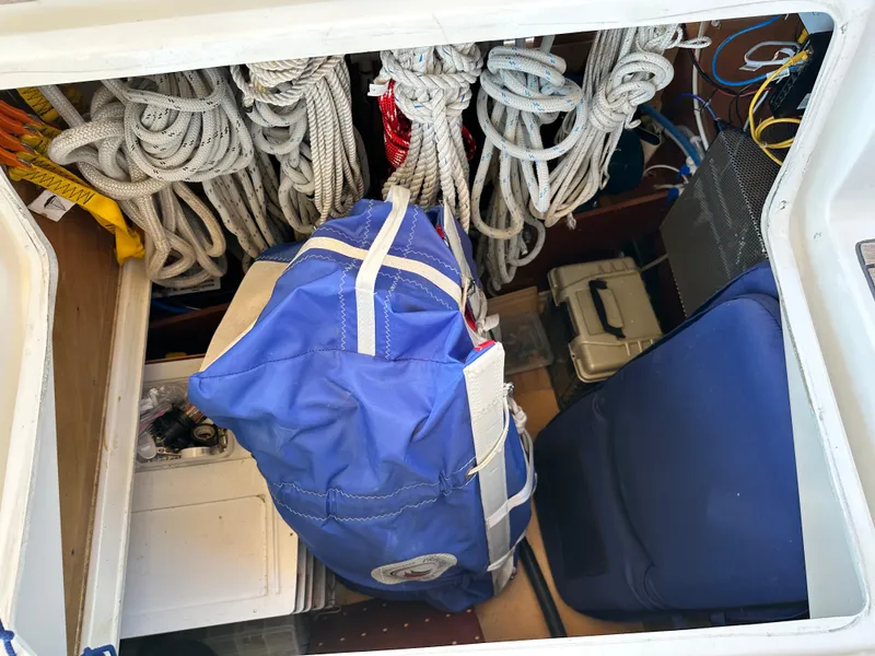 Slide: The Image of Storage compartment of a 2012 Beneteau Oceanis 41 with ropes and a blue bag. - 17