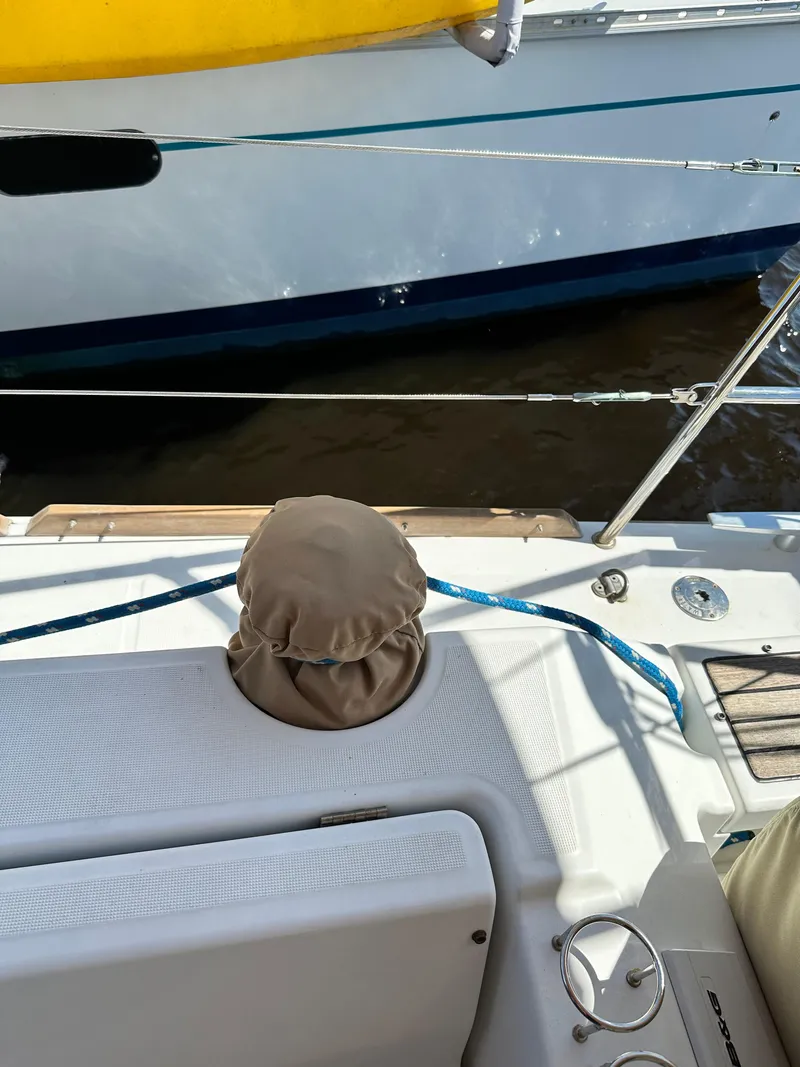 Slide: The Image of Beneteau Oceanis 41 sailboat deck, 2012 model, with mooring lines and covered winch. - 29