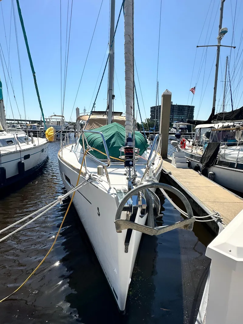 Slide: The Image of 2012 Beneteau Oceanis 41 sailboat docked at marina under clear blue sky. - 3