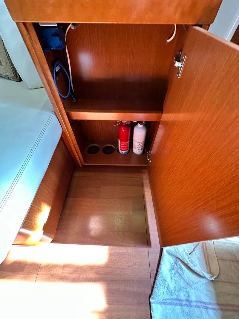 Slide: The Image of Interior cabinet of 2012 Beneteau Oceanis 41 yacht with fire extinguishers. - 46