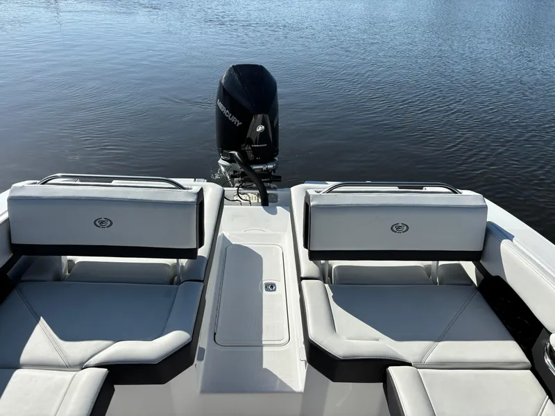 Slide: The Image of 2025 Cobalt R6 Outboard boat with dual seating, on calm water. - 10