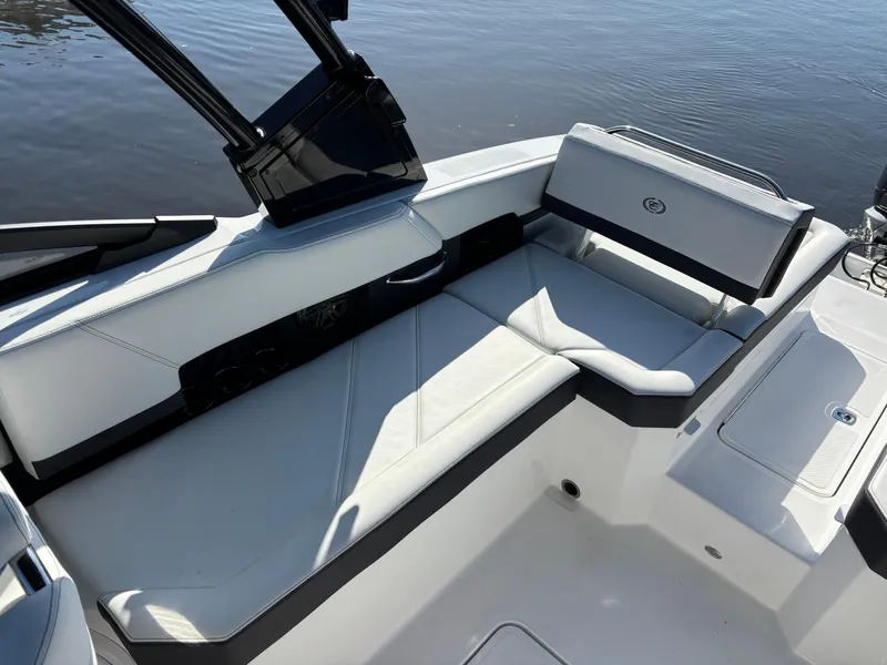 Slide: The Image of 2025 Cobalt R6 Outboard boat interior with sleek white seating and modern design. - 11