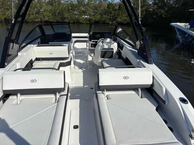 Slide: The Image of 2025 Cobalt R6 Outboard boat interior with white seating and sleek design. - 12