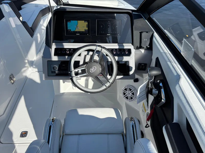 Slide: The Image of 2025 Cobalt R6 Outboard cockpit with modern steering and navigation displays. - 7