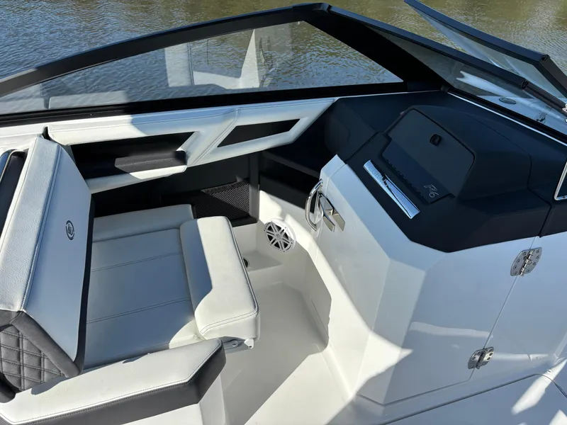 Slide: The Image of 2025 Cobalt R6 Outboard boat interior with sleek seating and modern dashboard design. - 8