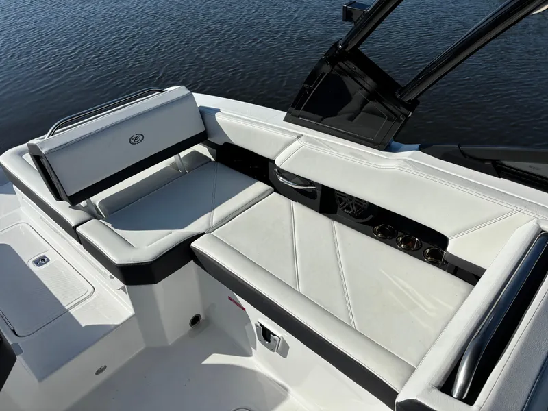 Slide: The Image of 2025 Cobalt R6 Outboard boat interior with sleek white seating and modern design. - 9