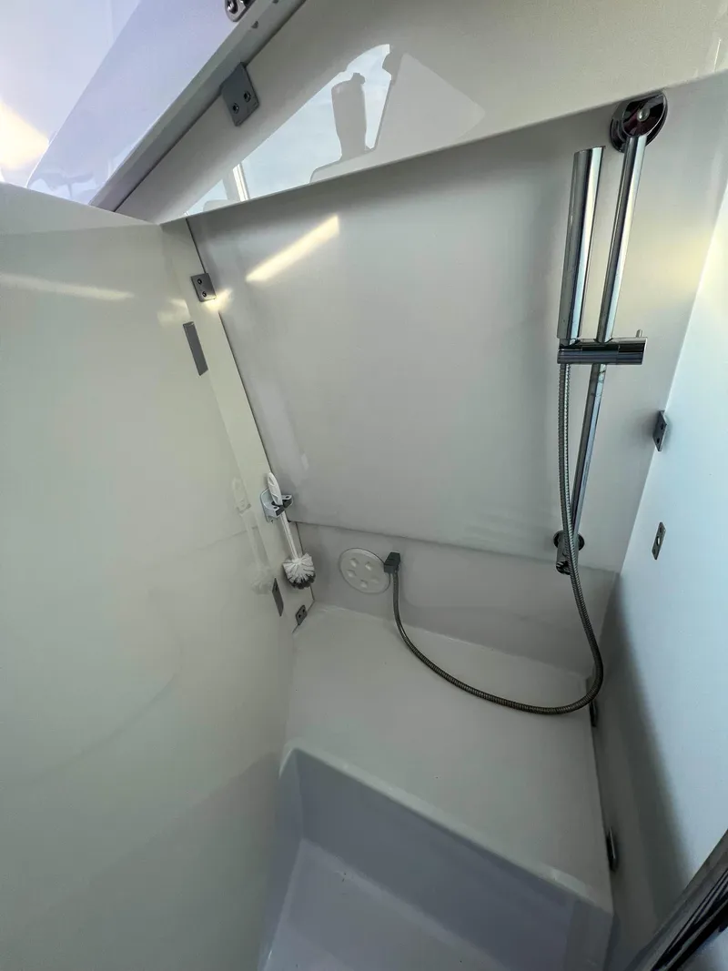 Slide: The Image of 2020 Axopar 37 XC boat shower area with modern fixtures and sleek design. - 17