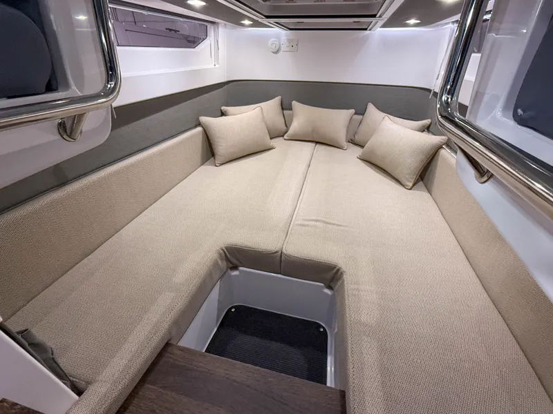 Slide: The Image of Luxurious interior cabin of 2020 Axopar 37 XC with beige cushions and modern design. - 24