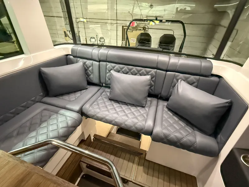 Slide: The Image of Luxurious seating area in 2020 Axopar 37 XC boat with quilted cushions. - 28