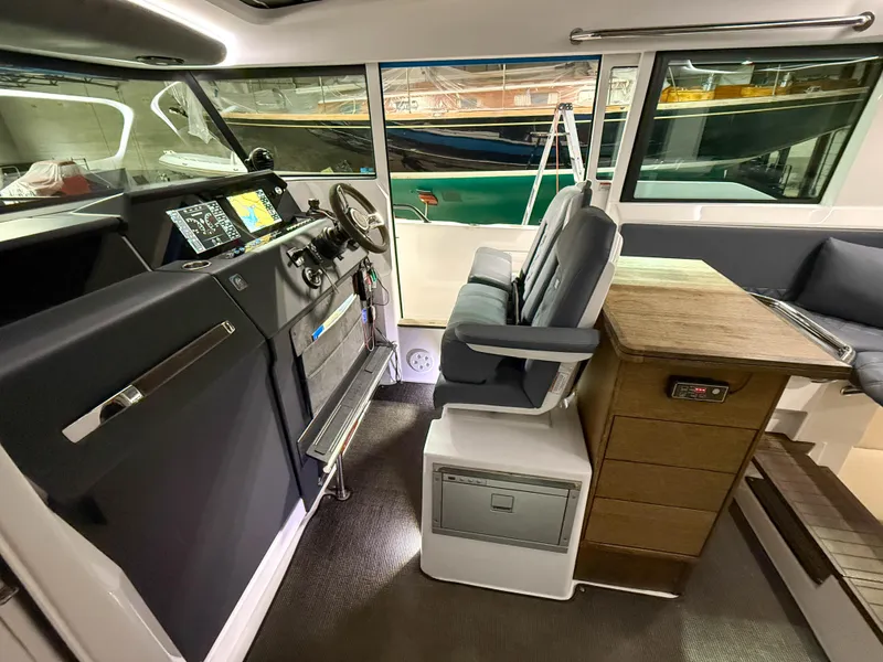 Slide: The Image of Interior of 2020 Axopar 37 XC boat with helm, seating, and navigation equipment. - 30