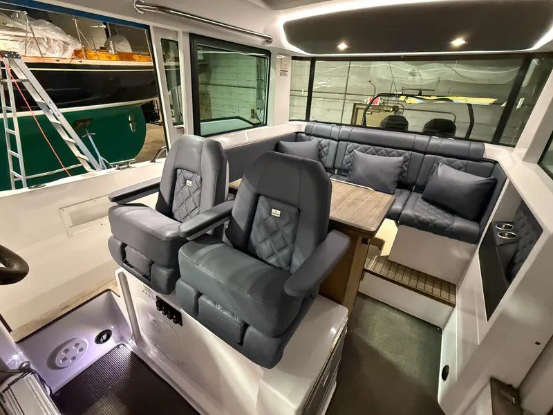 Slide: The Image of Luxurious interior of 2020 Axopar 37 XC boat with plush seating and modern design. - 32