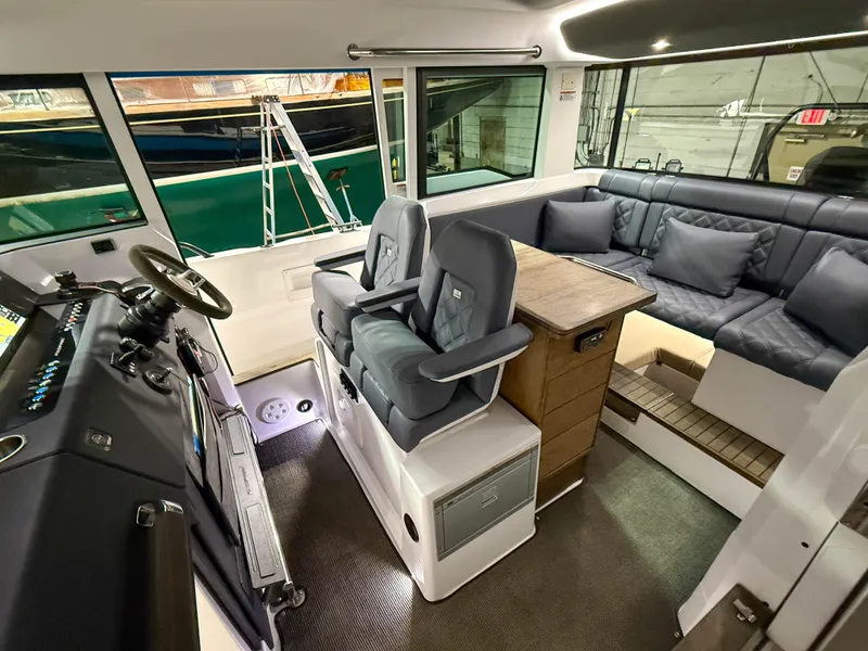 Slide: The Image of Interior of 2020 Axopar 37 XC boat with seating and helm station. - 33