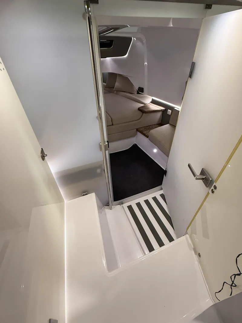 Slide: The Image of Interior of 2020 Axopar 37 XC boat, featuring modern seating and sleek design. - 38