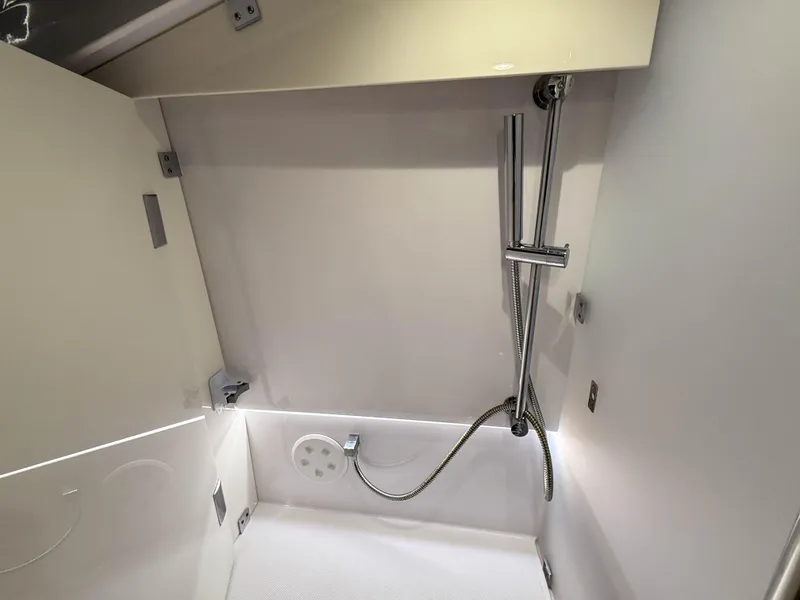 Slide: The Image of Shower area in 2020 Axopar 37 XC boat, featuring modern fixtures and sleek design. - 40