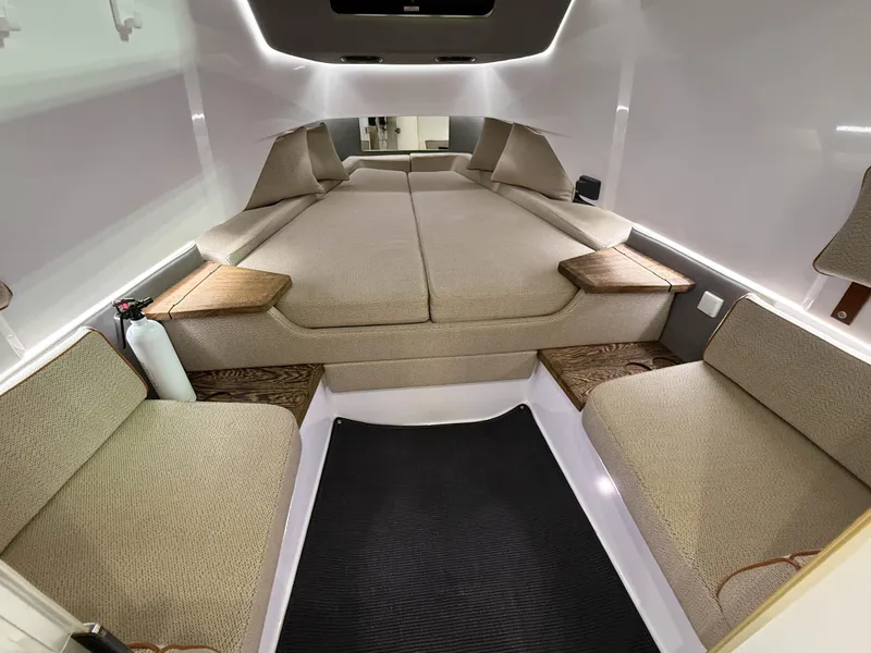 Slide: The Image of 2020 Axopar 37 XC cabin interior with beige seating and modern design. - 42