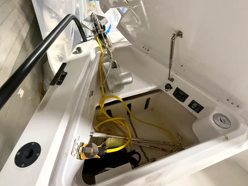 Slide: The Image of Storage compartment of 2020 Axopar 37 XC boat with equipment and wiring. - 48