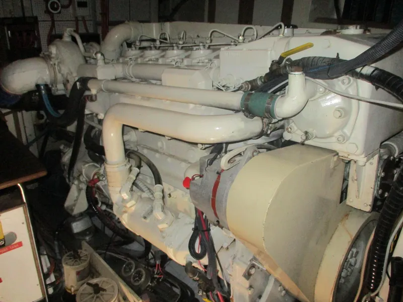 Slide: The Image of Engine room of a 1994 Grand Banks 49 Motoryacht, showcasing detailed mechanical components. - 10