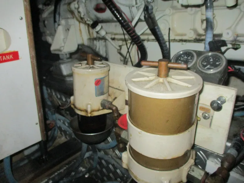 Slide: The Image of Engine room of 1994 Grand Banks 49 Motoryacht with fuel filters and gauges. - 16