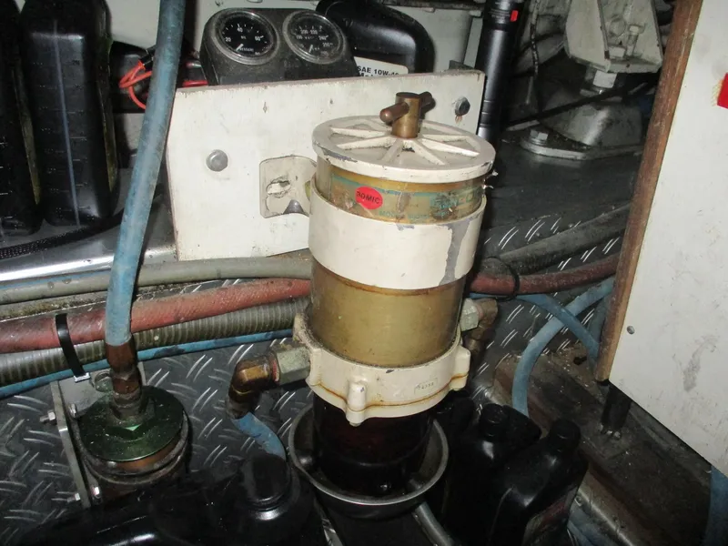 Slide: The Image of Engine room of 1994 Grand Banks 49 Motoryacht showing fuel filter system. - 17