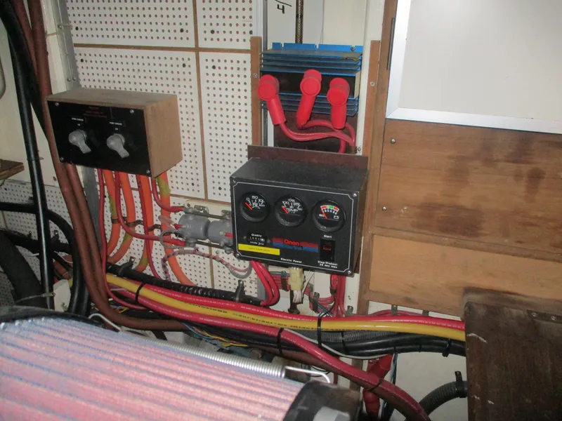 Slide: The Image of Electrical panel and wiring inside a 1994 Grand Banks 49 Motoryacht engine room. - 23