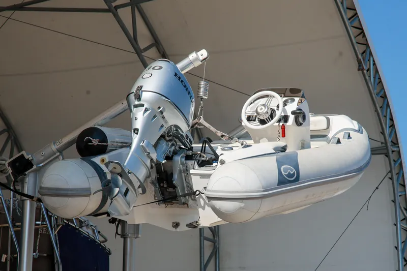 Slide: The Image of Inflatable boat with outboard motor on Grand Banks 49 Motoryacht, 1994 model. - 37