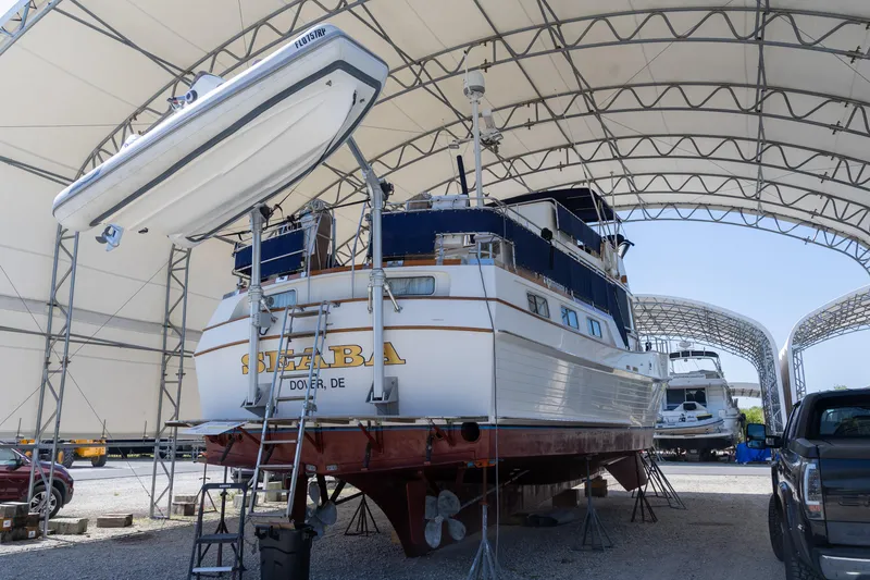 Slide: The Image of 1994 Grand Banks 49 Motoryacht in dry dock under a large canopy. - 41