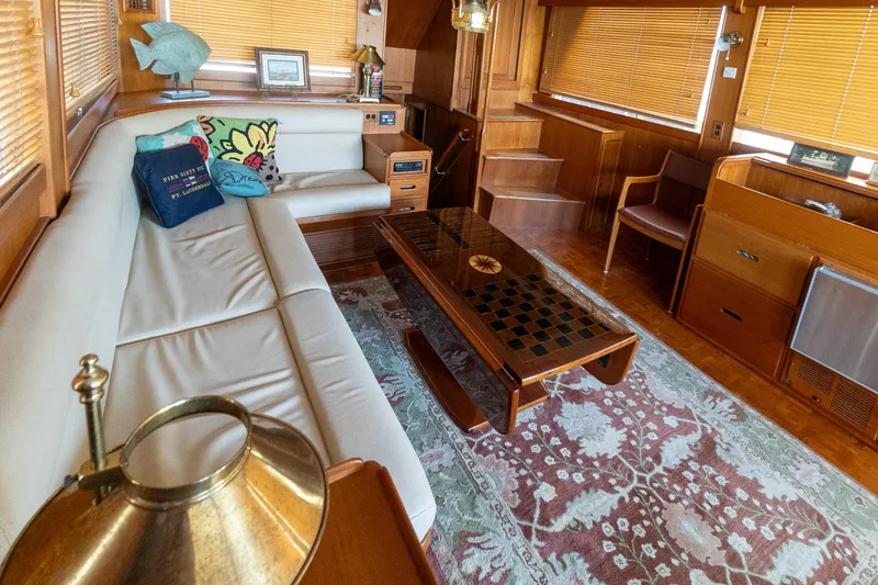 Slide: The Image of Luxurious 1994 Grand Banks 49 Motoryacht interior with elegant wood finishes and comfortable seating. - 49