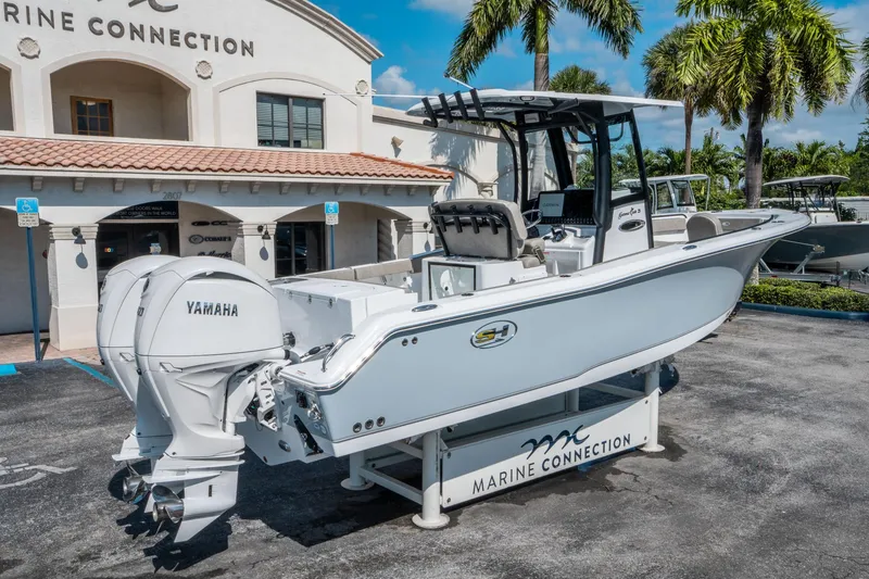 Slide: The Image of 2025 Sea Hunt Gamefish 25 boat with Yamaha engines at Marine Connection dealership. - 2