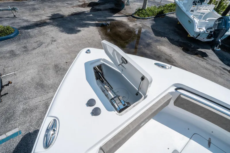 Slide: The Image of 2025 Sea Hunt Gamefish 25 boat with open storage compartment on deck. - 32
