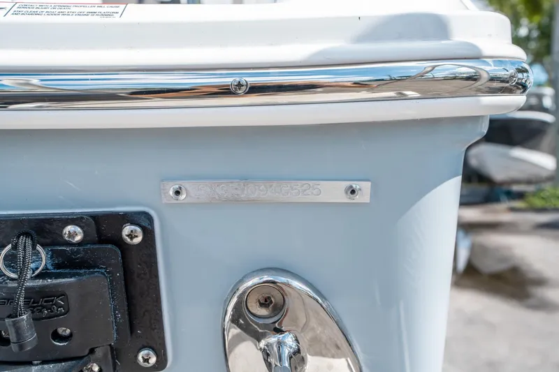 Slide: The Image of 2025 Sea Hunt Gamefish 25 boat detail with identification plate and hardware. - 36