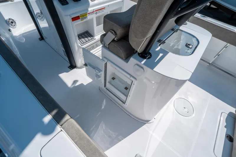 Slide: The Image of 2025 Sea Hunt Gamefish 25 boat interior with seating and storage compartments. - 16