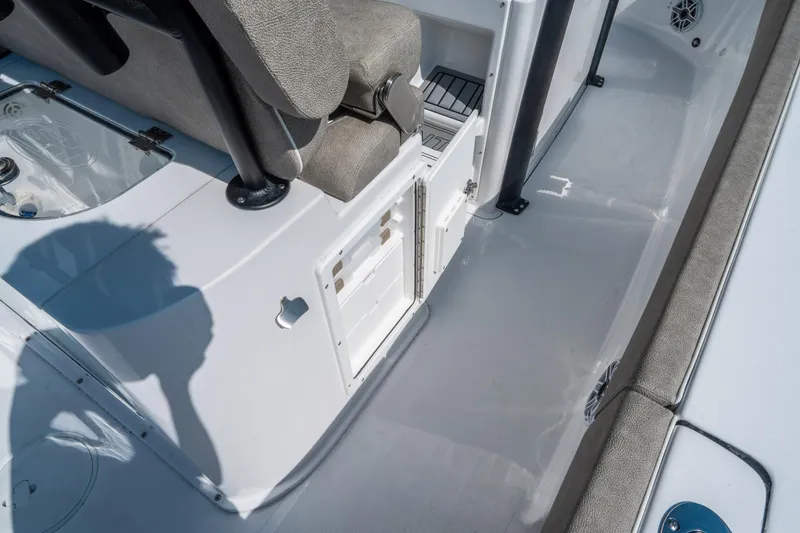 Slide: The Image of 2025 Sea Hunt Gamefish 25 boat interior with seating and storage compartments. - 17