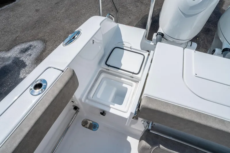 Slide: The Image of 2025 Sea Hunt Gamefish 25 boat interior with open storage compartment. - 33